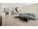 Open-concept living area flows into the kitchen with wood-look tile flooring at 3908 Grassland Dr, Orlando, FL 32824