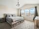 Spacious main bedroom features vaulted ceilings and an abundance of natural light at 3908 Grassland Dr, Orlando, FL 32824