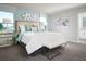 Calming main bedroom with modern decor, soft lighting, and a picturesque window view at 4353 Switchgrass Ln, St Cloud, FL 34772