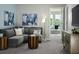 Cozy living room with comfortable seating, an entertainment center, and stylish decor at 4353 Switchgrass Ln, St Cloud, FL 34772