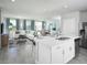 Open floor plan with ample natural light featuring stainless appliances and modern finishes at 4353 Switchgrass Ln, St Cloud, FL 34772