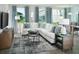 Comfortable living room with sofa, modern rug, and many windows for plenty of natural light at 4353 Switchgrass Ln, St Cloud, FL 34772