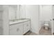 Bathroom featuring a granite countertop double vanity and tiled floors and a toilet at 4365 Switchgrass Ln, St Cloud, FL 34772