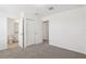 Neutral bedroom with carpet and a walk-in closet close to the adjacent bathroom at 4365 Switchgrass Ln, St Cloud, FL 34772