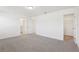 Bedroom featuring carpet floors, a walk-in closet and an ensuite bathroom at 4365 Switchgrass Ln, St Cloud, FL 34772