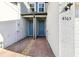 Townhome entrances feature matching blue doors and brick paths at 4365 Switchgrass Ln, St Cloud, FL 34772