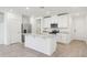 Modern kitchen features stainless steel appliances and a center island at 4365 Switchgrass Ln, St Cloud, FL 34772