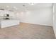 Open-concept kitchen with white cabinets and granite countertops at 4365 Switchgrass Ln, St Cloud, FL 34772