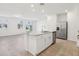 Spacious kitchen area with a center island and stainless steel appliances at 4365 Switchgrass Ln, St Cloud, FL 34772
