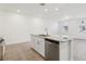 Kitchen island featuring granite countertops, stainless steel dishwasher, and a double sink at 4365 Switchgrass Ln, St Cloud, FL 34772