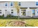 Exterior backyard featuring patio and newly planted tree at 4369 Switchgrass Ln, St Cloud, FL 34772