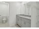Bathroom featuring double sinks, granite countertops, and plenty of storage space at 4369 Switchgrass Ln, St Cloud, FL 34772