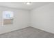Bright, carpeted bedroom with a window offering natural light at 4369 Switchgrass Ln, St Cloud, FL 34772