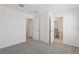 Carpeted bedroom with closet and bathroom access at 4369 Switchgrass Ln, St Cloud, FL 34772
