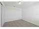 Bedroom featuring neutral carpet and spacious closet at 4369 Switchgrass Ln, St Cloud, FL 34772