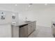 Open concept kitchen with island, stainless steel appliances, and an abundance of natural light at 4369 Switchgrass Ln, St Cloud, FL 34772