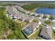 An aerial view shows the perimeter of the property in relation to a nearby pond at 512 Stowers Dr, New Smyrna Beach, FL 32168