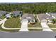 Aerial view of homes featuring well-manicured lawns in a desirable neighborhood at 512 Stowers Dr, New Smyrna Beach, FL 32168