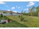 This backyard features well manicured grass, potted plants, and perimeter fence at 512 Stowers Dr, New Smyrna Beach, FL 32168