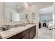 Elegant bathroom with double sinks, granite countertops, and modern fixtures at 512 Stowers Dr, New Smyrna Beach, FL 32168