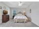 Serene bedroom with a comfortable bed, dresser, and soft lighting at 512 Stowers Dr, New Smyrna Beach, FL 32168