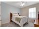 Bright bedroom with soft blue walls, plush carpet and a large window creates a relaxing space at 512 Stowers Dr, New Smyrna Beach, FL 32168