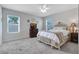Bright and airy bedroom with a bed, dresser, and ample natural light at 512 Stowers Dr, New Smyrna Beach, FL 32168
