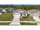 Well maintained single-Gathering home with two car garage and landscaped front yard with St. Augustine grass at 512 Stowers Dr, New Smyrna Beach, FL 32168