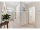 Bright hallway with tile flooring, leading to the home's entrance and other rooms at 512 Stowers Dr, New Smyrna Beach, FL 32168