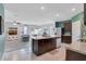Bright kitchen with a large island and an open layout leading to the living room at 512 Stowers Dr, New Smyrna Beach, FL 32168