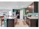 Bright kitchen with a spacious island, stainless steel appliances, granite countertops and tile flooring at 512 Stowers Dr, New Smyrna Beach, FL 32168