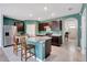 Stylish kitchen with modern stainless steel appliances, granite countertops, and an island with seating at 512 Stowers Dr, New Smyrna Beach, FL 32168