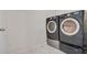 Modern laundry room equipped with front load washer and dryer providing convenience and style at 512 Stowers Dr, New Smyrna Beach, FL 32168