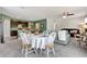 Open concept living and dining area with view of the kitchen, perfect for entertaining at 512 Stowers Dr, New Smyrna Beach, FL 32168