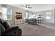 Comfortable living room featuring large windows, plush seating, and neutral decor at 512 Stowers Dr, New Smyrna Beach, FL 32168