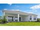 Spacious backyard featuring a covered patio, perfect for outdoor entertaining and relaxation at 5641 Nevis Ter, Kissimmee, FL 34758