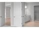 Contemporary bathroom with access to multiple areas, and modern white cabinets at 5641 Nevis Ter, Kissimmee, FL 34758