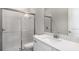 Clean bathroom features a glass enclosed shower, white vanity, and modern sink at 5641 Nevis Ter, Kissimmee, FL 34758