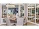 Formal dining room featuring a modern chandelier and ample seating for entertaining guests at 5641 Nevis Ter, Kissimmee, FL 34758