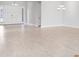 Bright entryway featuring a double door entrance and pristine hardwood floors at 5641 Nevis Ter, Kissimmee, FL 34758