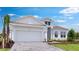 Charming two-story home with manicured landscaping, a large two-car garage and a welcoming facade at 5641 Nevis Ter, Kissimmee, FL 34758