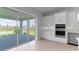 Gourmet kitchen with double oven, and sliding glass door leading to lanai and serene outdoor views at 5641 Nevis Ter, Kissimmee, FL 34758