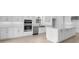 Spacious kitchen featuring a center island, stainless steel appliances, and ample counter space at 5641 Nevis Ter, Kissimmee, FL 34758