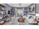 Cozy living room featuring stylish decor, a comfortable white sofa, and a decorative area rug at 5641 Nevis Ter, Kissimmee, FL 34758