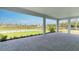 Relaxing outdoor patio offers serene water views, lush green space and ample room at 5641 Nevis Ter, Kissimmee, FL 34758