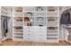 Spacious walk-in closet with custom shelving and drawers for organized storage at 5641 Nevis Ter, Kissimmee, FL 34758