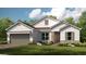 Charming single-story home with stone accents, a two-car garage, and a well-manicured front lawn at 5647 Nevis Ter, Kissimmee, FL 34758