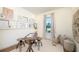 Bright home office with natural light, a modern desk, and ample storage with shelving and decor at 5647 Nevis Ter, Kissimmee, FL 34758