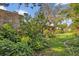 Well-maintained backyard featuring a variety of plants, shrubs, and trees, creating a peaceful outdoor space at 605 Sweetbriar Rd, Orlando, FL 32806