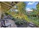 Lush backyard featuring tropical plants, a seating area, and a peaceful outdoor space at 605 Sweetbriar Rd, Orlando, FL 32806